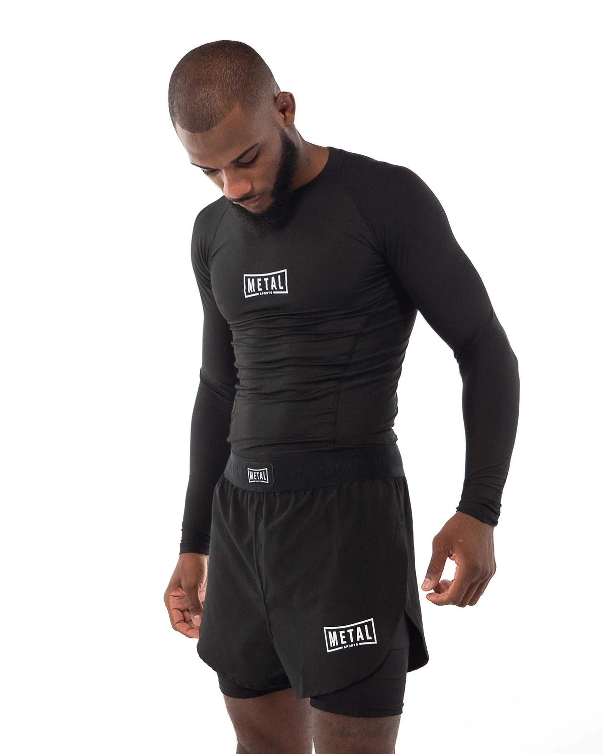 Rashguard Performance Manches Longues noir respirant et ajusté pour MMA et boxe.