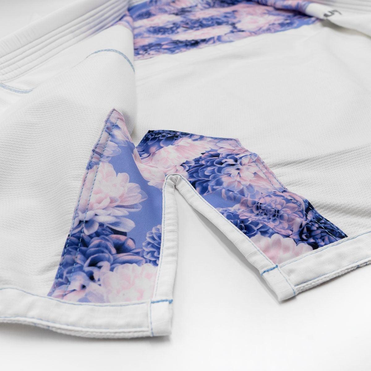 Close-up of white and blue Kimono BJJ Gi for women with floral Dahlia pattern inner lining from FUJIMAE