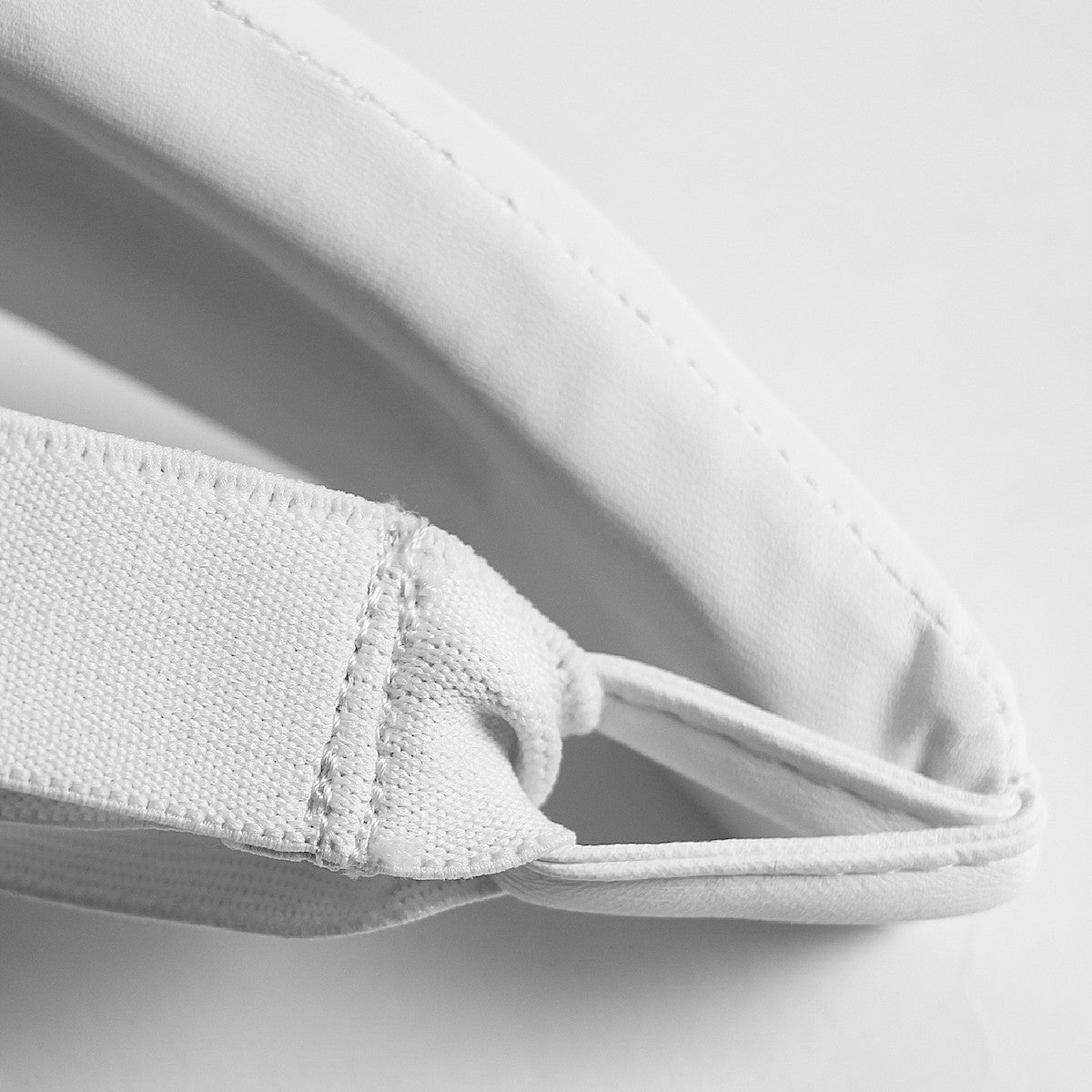 White Adidas women's protective groin guard with elastic strap for martial arts and combat sports