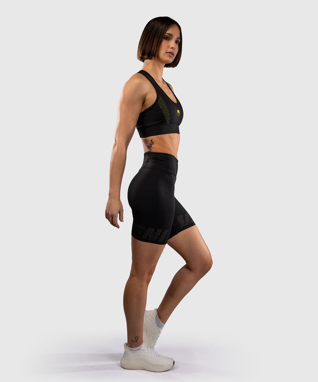 Short de compression Venum Lazer noir jaune pour femme, léger et confortable, idéal entraînement et cardio
