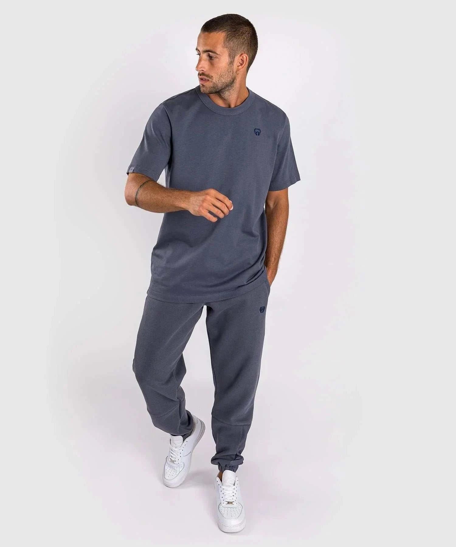 Man wearing blue Venum Silent Power t-shirt and matching joggers with round neck and short sleeves.